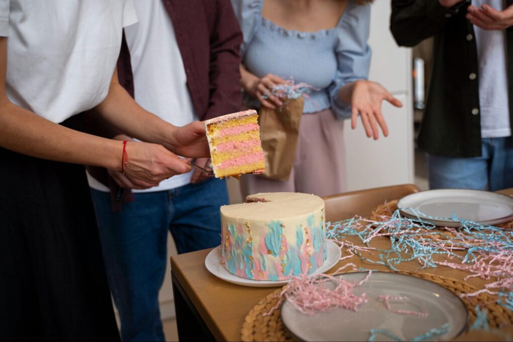 A man holding a piece of cake at a party