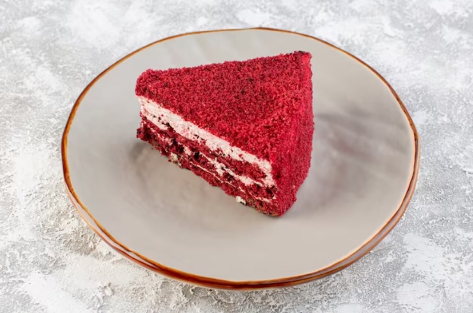 a close front view of a red velvet cake slice inside a plate